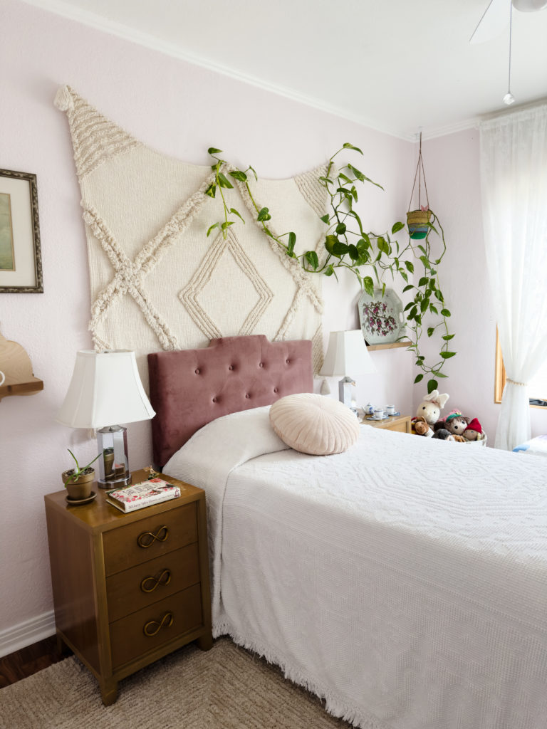 pink girls room, hanging plant, wood nightstands