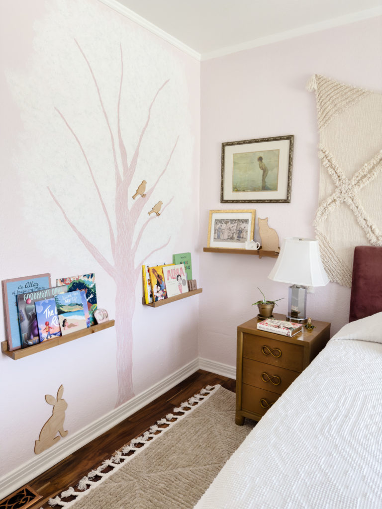 pink painted tree on wall, children books