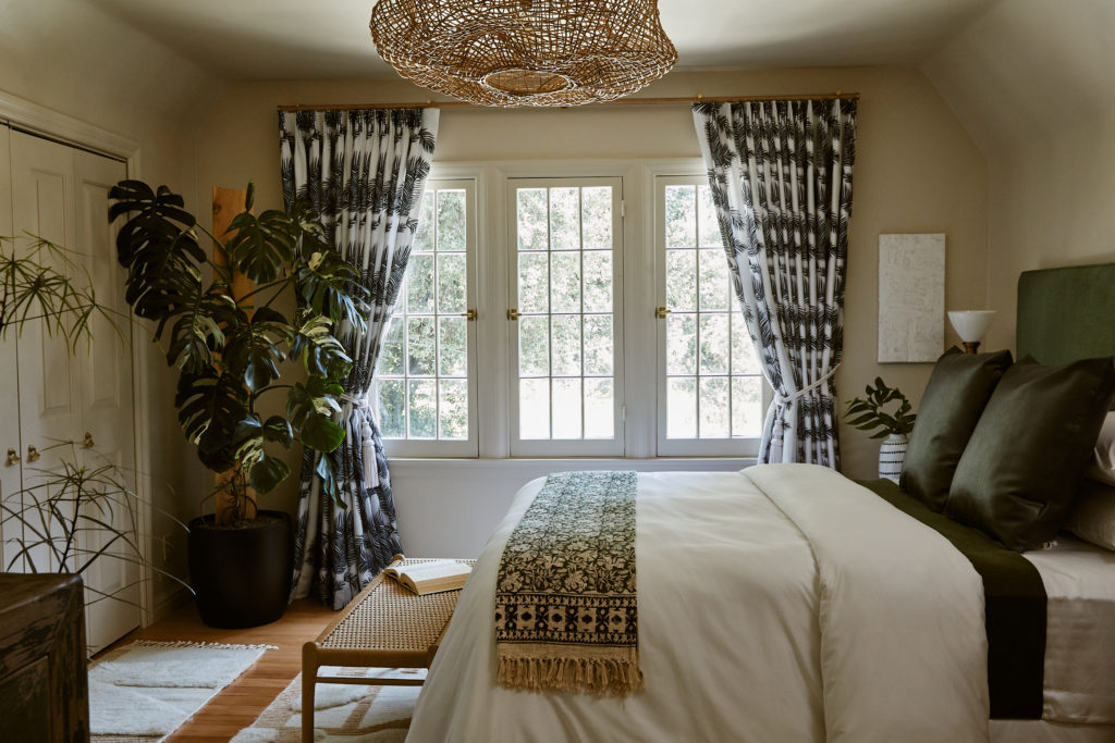 bedroom, black and white curtains, wood bench, wicker pendent