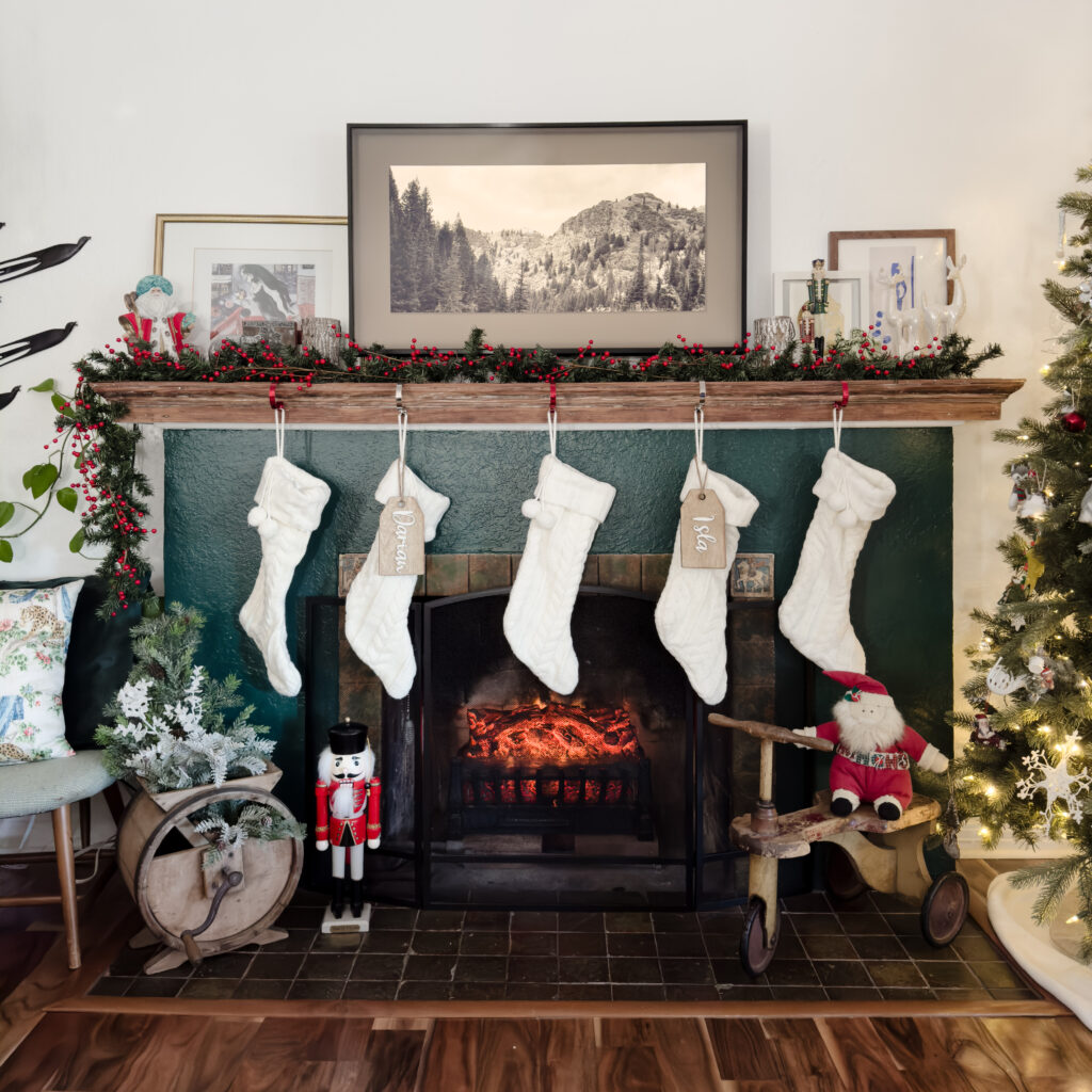 Green fireplace, white stockings, christmas tree, santa, nutcracker